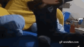 a gif of a person laying on a bed with the website gif-erstellen.com visible in the corner