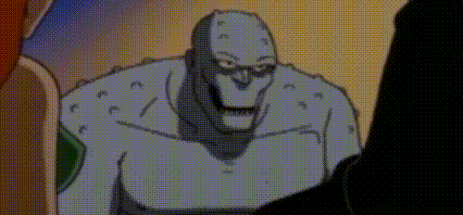 a cartoon character is standing next to a man in a dark room .