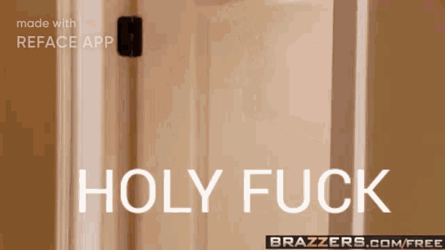 a man standing in a doorway talking on a cell phone with the words holy fuck on the bottom