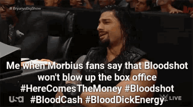 roman reigns is sitting in the audience watching a wrestling match while fans say that bloodshot won 't blow up the box office
