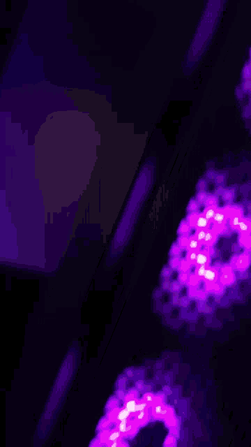 a blurry picture of purple lights with a purple background