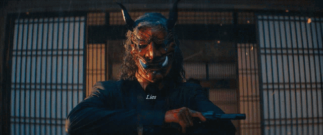 a close up of a person wearing a mask with the words lies written on the bottom