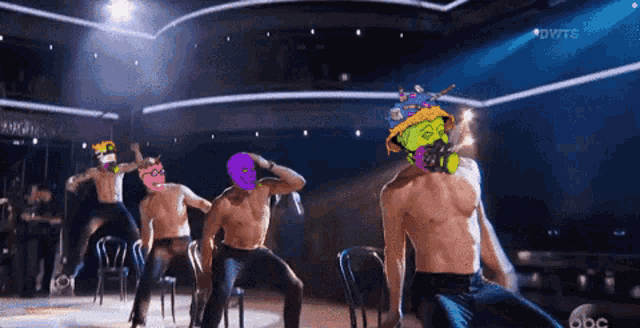 a group of men are dancing on a stage with the abc logo in the corner
