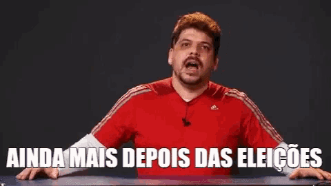 a man in a red adidas shirt says " ainda mais depois das eleiçoes "