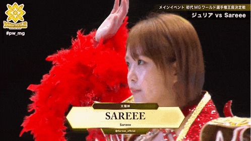 a woman in a red feather boa with the name sareee