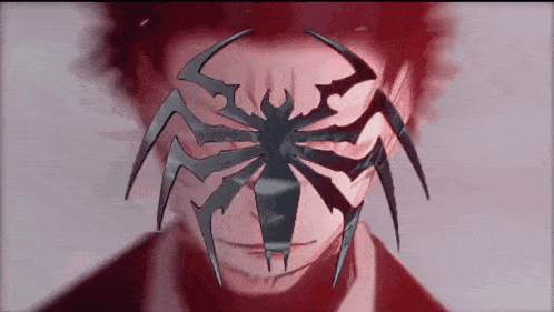 a close up of a person wearing a spider mask .