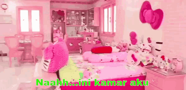 a bedroom decorated in pink with a bed , nightstand , dresser , and a hello kitty pillow .