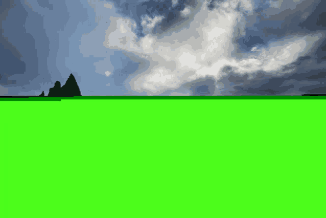 a green screen with a mountain in the background and clouds in the sky