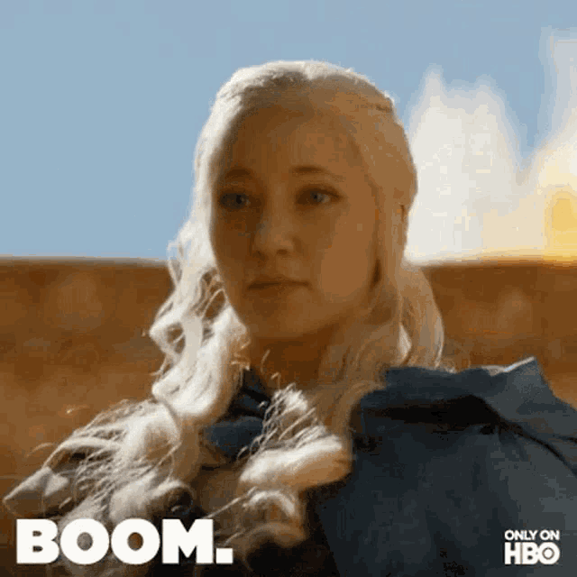 a close up of a woman 's face with the word boom written on it