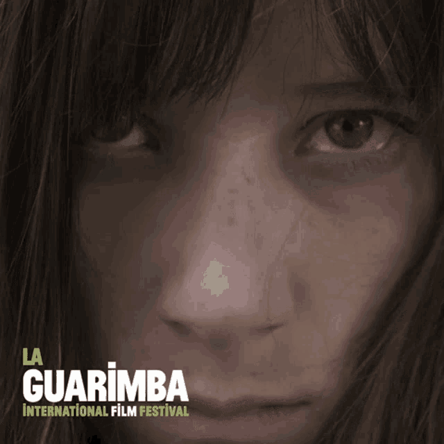 a poster for la guarimba international film festival with a close up of a woman 's face
