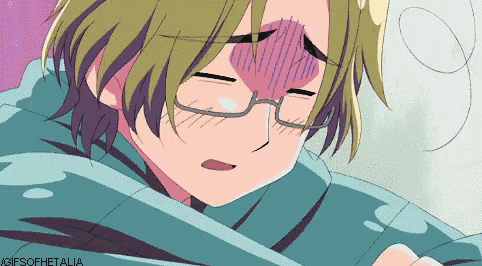 a gif of a boy with glasses laying down