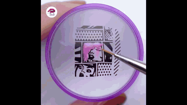 a person is holding a purple circle with a picture of a woman on it