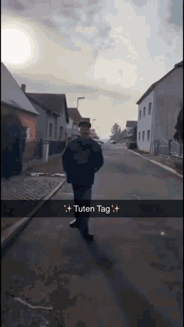 a man walking down a street with a caption that says " tuten tag " on it