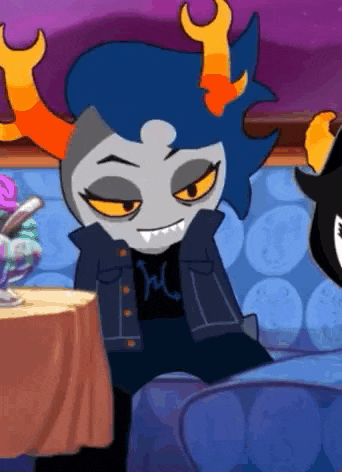 a cartoon character with blue hair and orange horns is sitting on a couch