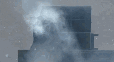 a smoke filled room with a cbs logo on the bottom right