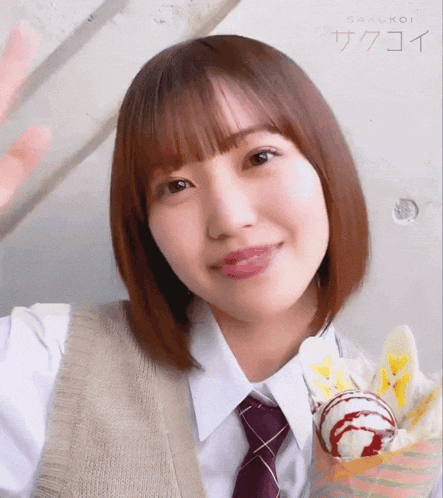 a girl wearing a white shirt and tie is holding an ice cream cone in her hand