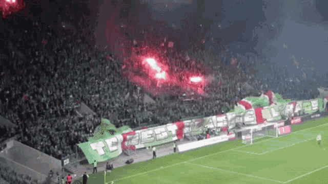 a soccer field with a banner that says ' to best ' on it
