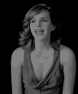 a black and white photo of a woman in a plunging neckline dress