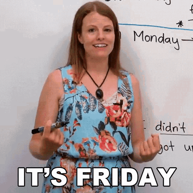 a woman standing in front of a white board with the words it 's friday