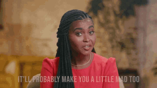 a woman in a red dress is sitting on a couch and says it 'll probably make you a little mad too