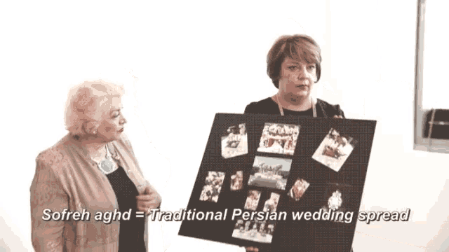 two women are standing next to each other holding a board that says sofreh aghd traditional persian wedding spread on it