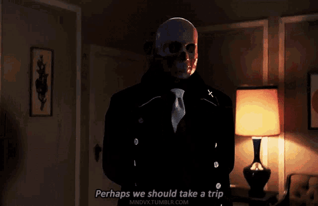 a man with a skull on his face says perhaps we should take a trip in a dark room