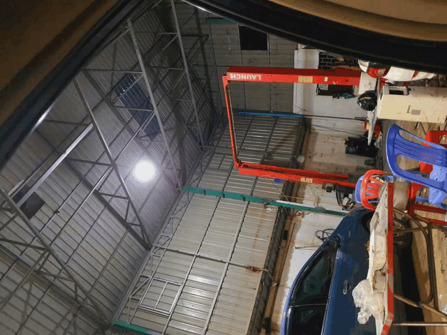 a red launch lift is in a garage