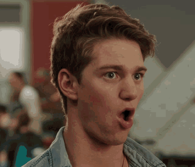 a young man making a surprised face with his mouth wide open