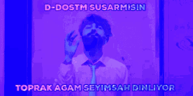 a man in a shirt and tie is smoking a cigarette in a purple room