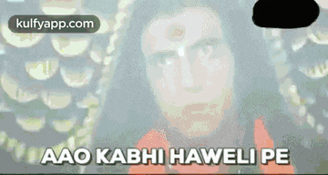 a close up of a man 's face with the words aao kabhi haveli pe written on the bottom