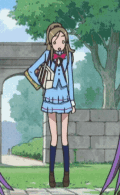 a girl in a blue school uniform is standing in front of a brick wall