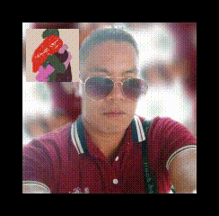 a man wearing sunglasses and a red shirt has a picture of a woman behind him with the words " i love you " on it