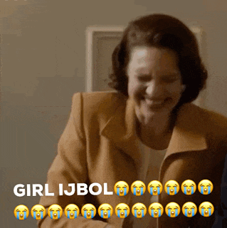 a woman in a brown jacket is laughing and crying with the words girl ijbol behind her