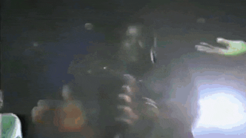 a blurred image of a person holding a cell phone