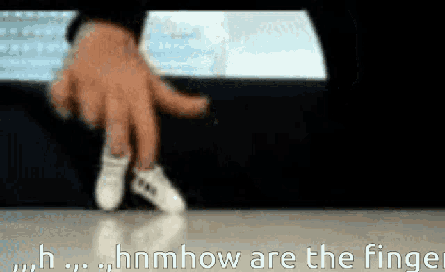 a blurred image of a person 's hand with the words " hnmhow are the finger "