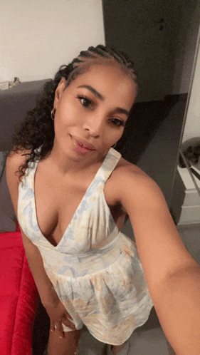 a woman taking a selfie with a plunging neckline