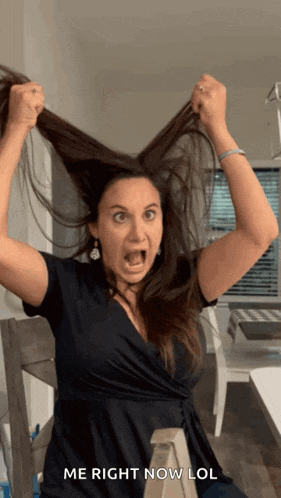 a woman in a black dress holds her hair up in the air with the words me right now lol below her