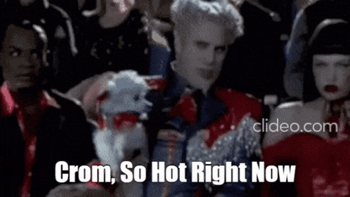 a man holding a stuffed animal with the words crom so hot right now written below him