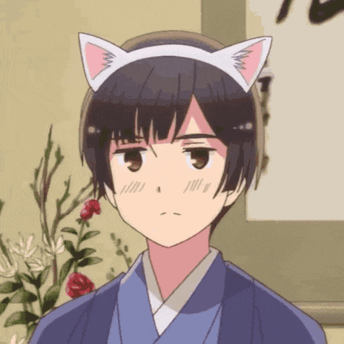 a young boy wearing a cat ear headband