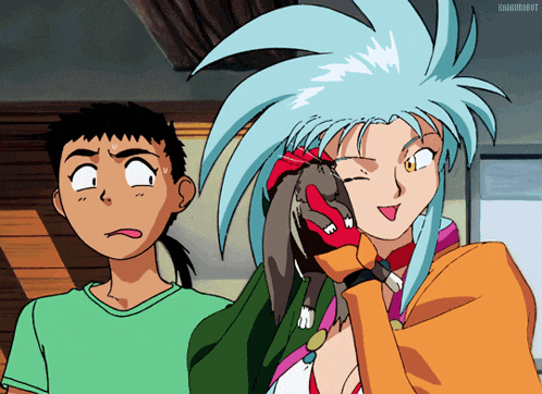 a boy and a girl are standing next to each other and the girl has a cat on her shoulder