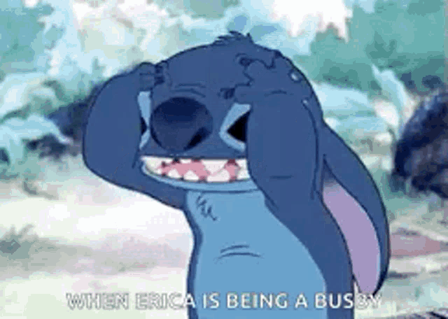 a cartoon of stitch covering his eyes with his hands and the words `` when erica is being a busy '' .