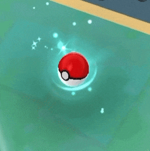 a red and white pokeball is floating in a circle