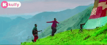 a man is carrying a woman on his back with a kulfy logo behind them