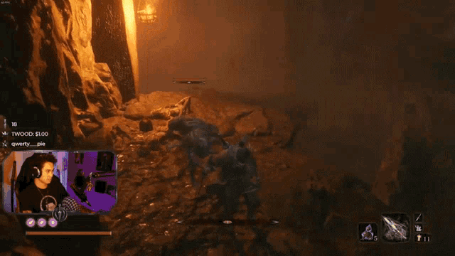 a man playing a video game with a purple screen that says twwood