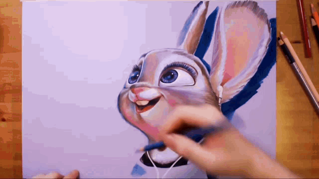 a person is drawing a cartoon rabbit with headphones on