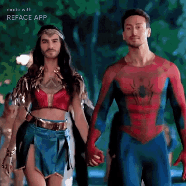 a man in a wonder woman costume and a man in a spiderman costume holding hands