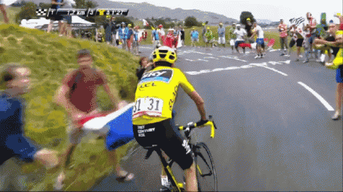 a man riding a bike with the number 31 on the back