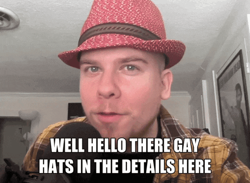 a man wearing a red hat with the words well hello there gay hats in the details here