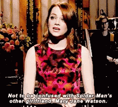 a woman in a pink floral dress is talking about spider-man 's other girlfriend mary jane watson