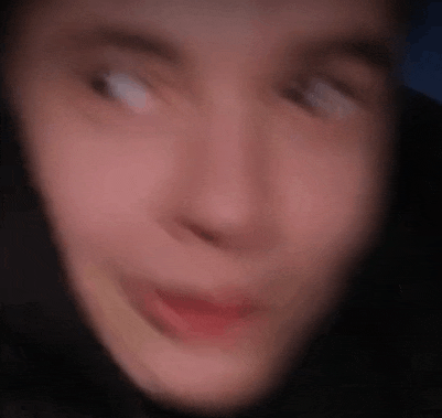 a close up of a person 's face with a blurry background